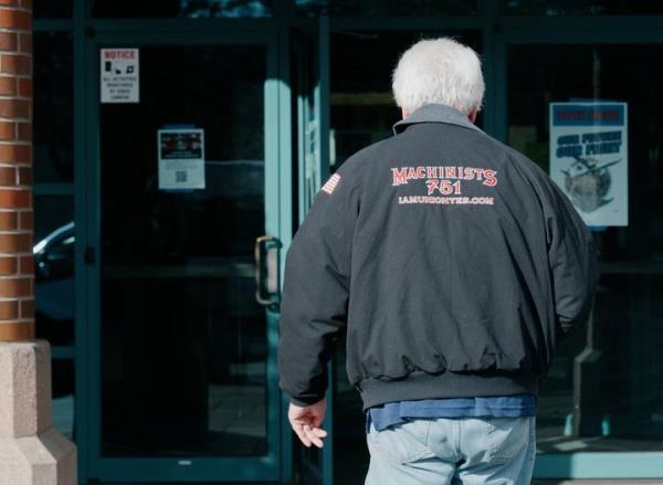 A Boeing Machinist Unio<em></em>n member enters the IAM District 751 Unio<em></em>n Hall to vote on the latest co<em></em>ntract presented by the airline giant after weeks of striking, in Seattle, Washington October 23, 2024. Boeing reported a whopping $6.2 billion quarterly loss Wednesday as a nearly six-week labor strike weighed on its commercial plane division and costly problems dragged down its defense and space business.The embattled aviation giant, which has been under scrutiny from regulators following safety problems, will learn later in the day if Seattle-area employees will accept the company's latest proposal, ending the bruising work stoppage. (Photo by Grant Hindsley / AFP) (Photo by GRANT HINDSLEY/AFP via Getty Images)