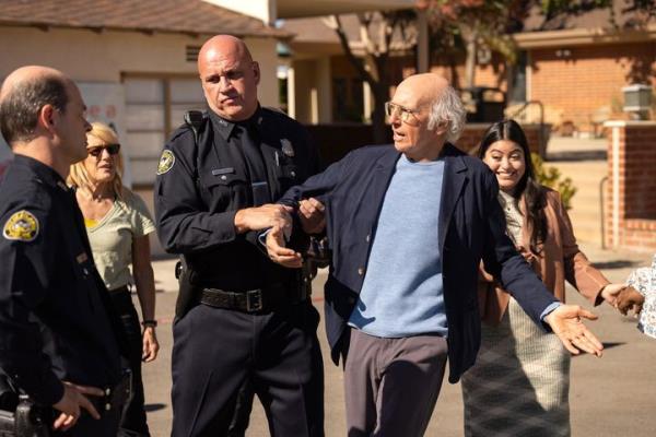 Larry David gets arrested for handing a water bottle to a woman waiting to vote in an episode of 