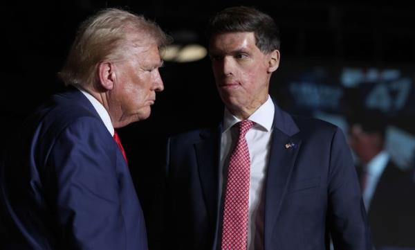 Former President Do<em></em>nald Trump stands with Sam Brown, a Republican candidate for Senate in Nevada, during a Sept. 13 campaign rally in Las Vegas. Brown ignored questions a<em></em>bout Trump's mass deportation proposal at a campaign debate last month.