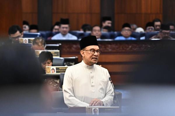 Anwar presenting the Budget 2025 in the Dewan Rakyat on Friday. 