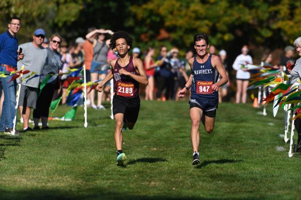 Manchester Valley's Logan Amis, right, passes Winters Mill's Kayden Hovermale to over take third place in the boys varsity race during the Carroll County cross country champio<em></em>nships at McDaniel College on Tuesday. (Brian Krista/Staff)