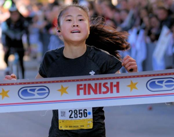 Sara Kenefick of Charlotte takes first place in the women's marathon during the 24th Annual Running Festival at the inner harbor. (Karl Merton Ferron/Staff)