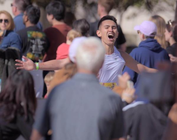 Litz Patrick Dizon of Middle River reacts during the final paces to the men's marathon finish during the 24th Annual Running Festival at the inner harbor. (Karl Merton Ferron/Staff)