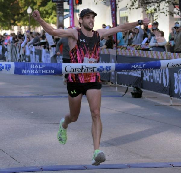 Nicolas Crouzier of Gaithersburg finishes first in thee half marathon during the 24th Annual Running Festival at the inner harbor. (Karl Merton Ferron/Staff)