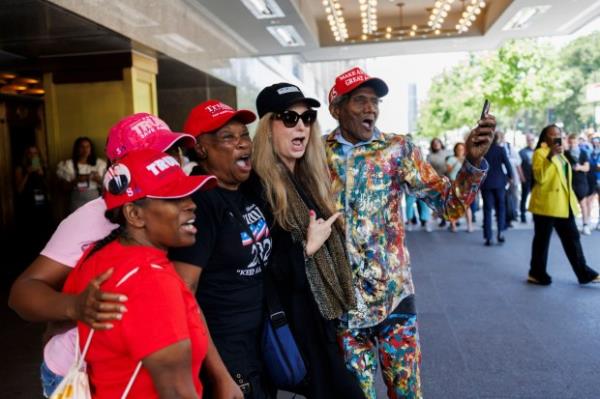 George Blakemore, right, chants with other supporters as former President Do<em></em>nald Trump attends the Natio<em></em>nal Association of Black Journalists convention near South Michigan Avenue on July 31, 2024 in Chicago. (Armando L. Sanchez/Chicago Tribune)