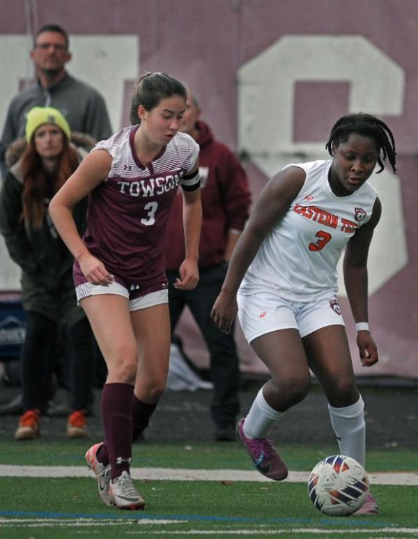 Towson's Koto Davis, left, marks Eastern Tech's Ineza Ross-Reidel, right, in the first half of girls soccer game. (Kenneth K. Lam/Staff)