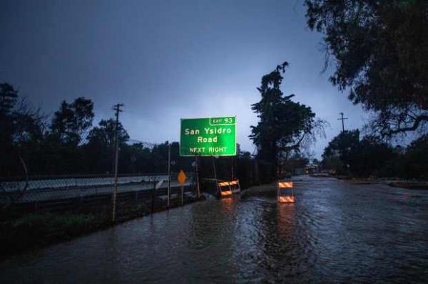 A road is seen flooded out as a result of San Ysidro Creek overflowing due to heavy rainfall in the area on January 10, 2023 in Montecito, California. (Photo by APU GOMES/AFP via Getty Images)