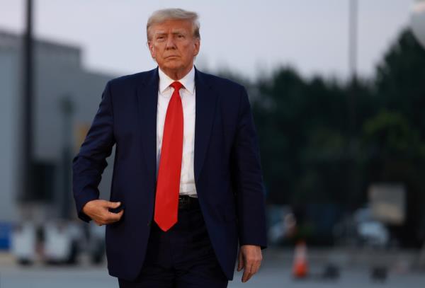 Former U.S. President Do<em></em>nald Trump arrives to depart at Atlanta Hartsfield-Jackson Internatio<em></em>nal Airport after being booked at the Fulton County jail on August 24, 2023 in Atlanta, Georgia.