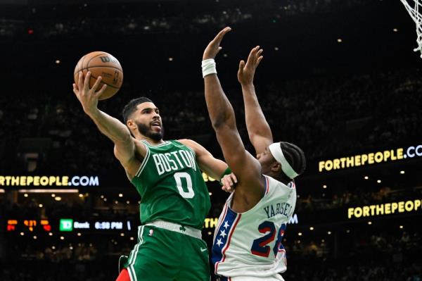 Jayson Tatum (0) and the Celtics are the defending NBA champions. 