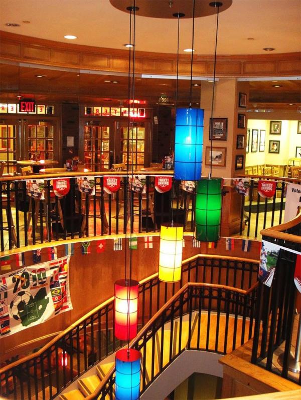 Spiral staircase with colorful lights in the Applebee's on 42nd Street, Times Square, New York, known for the high-priced New Year's Eve ball-drop tickets