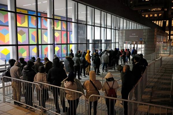 Migrants waiting in line for the ICE entrance