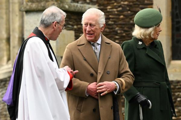 Britain's King Charles III (C) talks with Reverend Canon Paul Williams after attending the Royal Family's traditio<em></em>nal Christmas Day service at St Mary Magdalene Church in Sandringham, Norfolk, eastern England, on December 25, 2024.