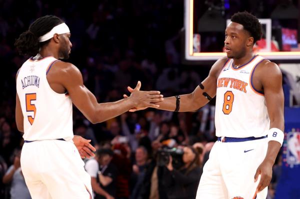 Precious Achiuwa #5 shakes hands with OG Anunoby #8 of the New York Knicks after defeating the San Anto<em></em>nio Spurs  at Madison Square Garden on December 25, 2024