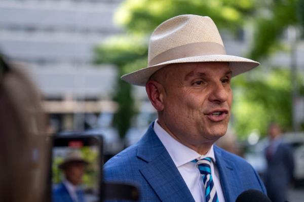 Arthur Aidala, wearing a hat