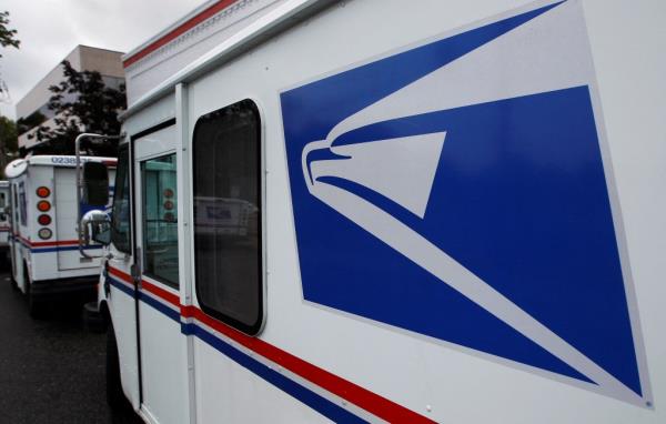 United States Postal Service trucks are seen in Manhasset, New York 