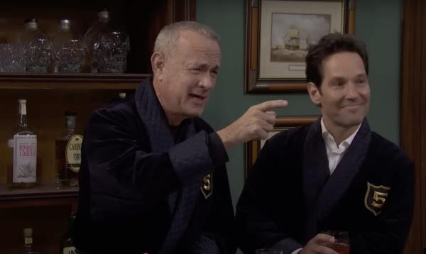 Tom Hanks pointing at Paul Rudd during an SNL appearance.