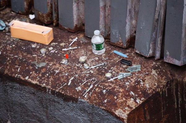 Syringes and drug paraphernalia scene on the ground near a subway track in The Hub on Dec. 15, 2024.