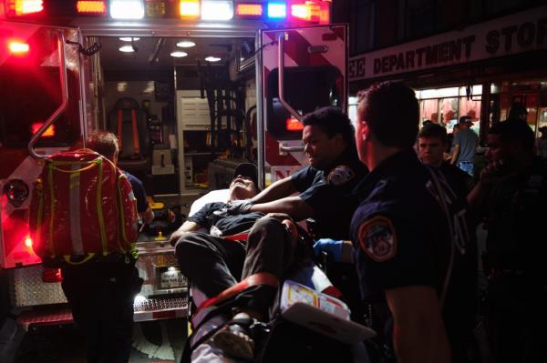 Paramedics and NYPD offices performing CPR on a man who reportedly went into cardiac arrest in The Hub on Aug. 30, 2024.