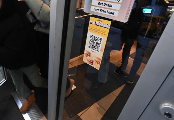 Phony QR code sticker claiming to offer free food posted on the window of a McDonald's in New York, used to share anti-Israel messages