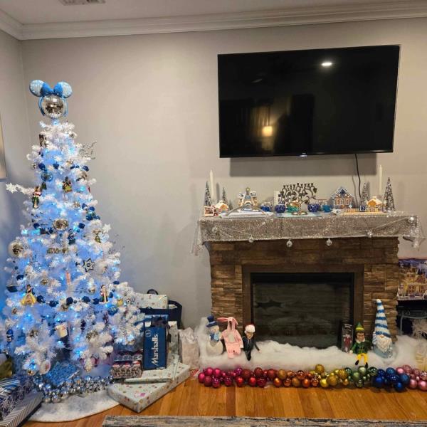 Renee Wygodaa??s Christmas and Hanukkah decorations including a tree decked out in blue and white