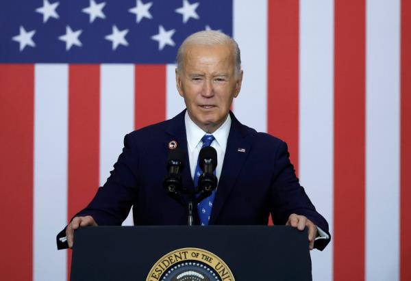 President Joe Biden speaking at the Department of Labor podium in Washington, DC, signing a proclamation, on December 16, 2024