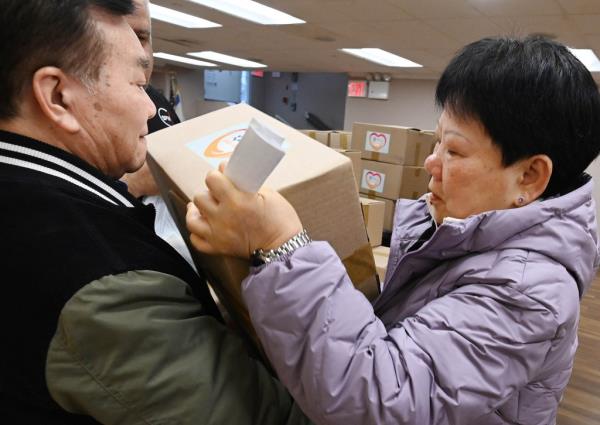 Tenants get their free food boxes at the B'nai B'rith Queens apartments