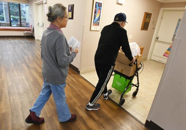 Residents take their free food home at the B'nai B'rith Queens apartments in Flushing