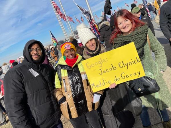 Diane Pagen protesting the NYC vaccine mandate with a group of people, holding a sign, alo<em></em>ngside Nicola Sanders