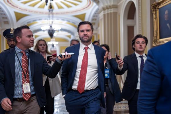 Sen. JD Vance, R-Ohio, the vice president-elect, leaves the Senate chamber as lawmakers work on an interim spending bill to avoid a shutdown of federal agencies, at the Capitol in Washington, Wednesday, Dec. 18, 2024. 