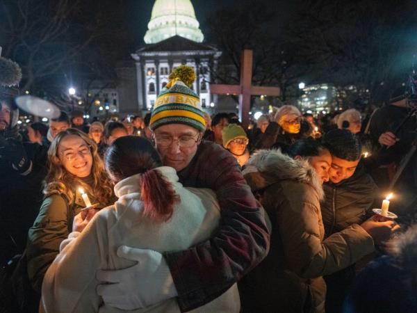 Several hundred people attend a vigil for school shooting victims on December 17, 2024 on Capitol Square in Madison, Wisconsin. 