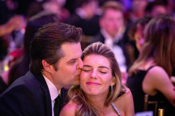 Former Florida Rep. Matt Gaetz kisses his wife Ginger at a NY Young Republicans event on Sunday.