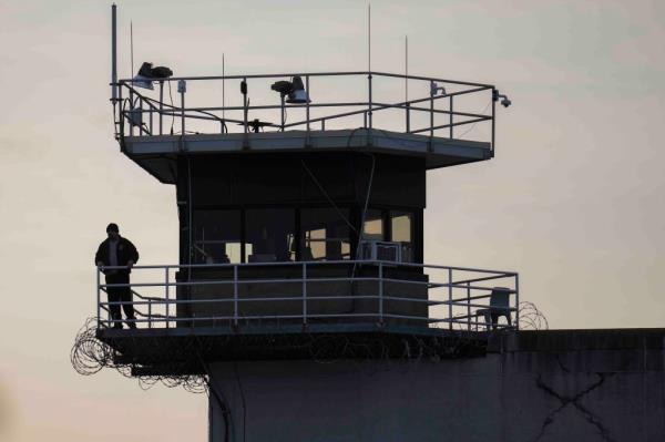 A guard stands in a tower at Indiana State Prison.