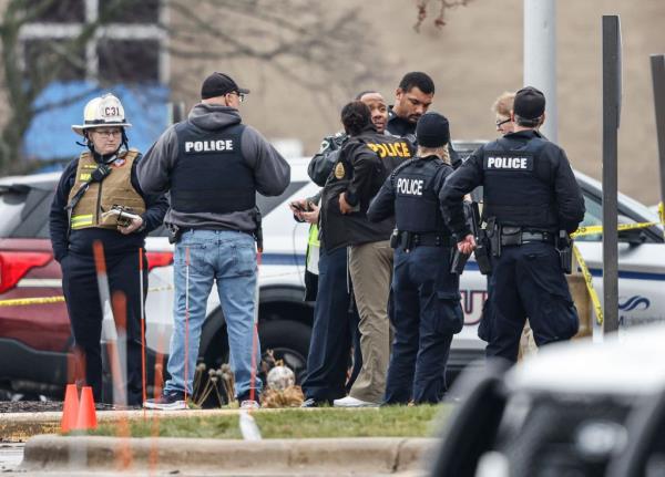 Police officers at a reunification center after a shooting at Abundant Life Christian School in Madison, Wisconsin.