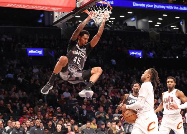 Keon Johnson dunks for the Nets during their loss to the Cavaliers on Dec. 16.