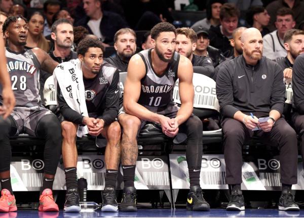 Ben Simmons sits on the bench during the Nets' loss to the Cavaliers on Dec. 16.