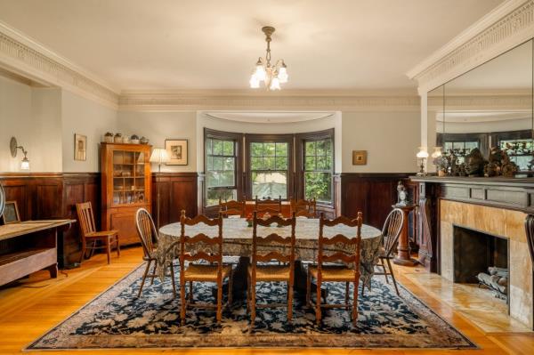 The formal dining room comes with a fireplace