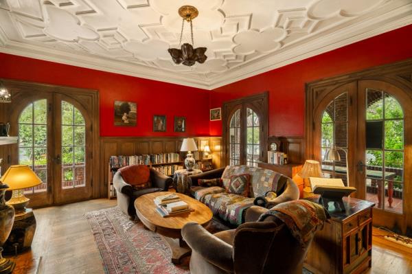 Noteworthy details extend from the ceilings to the arched doors and hardwood floors 