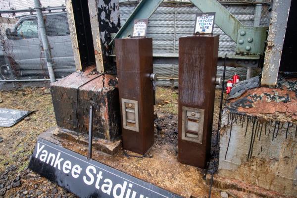 Old token machines and Yankees Stadium signs were among the numerous items up for grabs on Monday