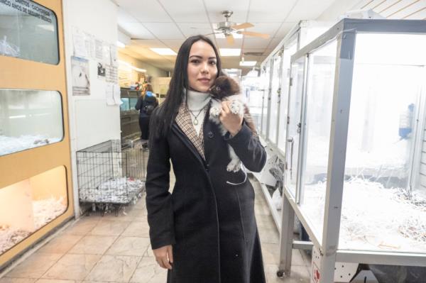 Ingrid Rodriguez, 25, with a Pomeranian puppy she bought at a bargain in Queens over the weekend